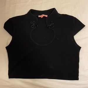 Black crop top with knotted neck closure
